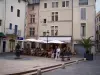 Nîmes - Café terrace and facades of houses of the Place aux Herbes square