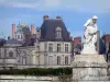 Palace of Fontainebleau - Statue (sculpture) in the foreground and Palace of Fontainebleau