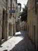 Périgueux - Narrow paved street lined with houses