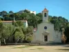 Porquerolles island - Church of the village, square decorated with trees, pines in background