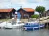 Porto de Larros - Barcos ancorados e cabanas no porto de ostras