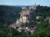 Rocamadour - View of sanctuaries, houses of the village, cliff and castle dominating the set, trees and the forest, in the Regional Nature Park of the Quercy Limestone Plateaus