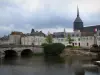 Romorantin-Lanthenay - Saint-Etienne church, houses of the city, bridge spanning the River Sauldre and turbulent sky, in Sologne