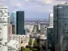 Roof of the Grande Arche in La Défense - View of buildings in the La Défense district and Paris from the roof of the Grande Arche