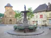 Saignes church - Place de l'Église: fountain, Sainte-Croix Romanesque church in the Auvergne, shops and houses in the village