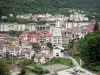 Saint-Claude - Playground by the river, houses and buildings of the city; in the Upper Jura Regional Nature Park