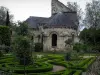 Saint-Cosme priory - Remains of the church, flowerbeds and rosebushes (pink roses) in the garden
