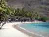 Les Saintes - Pompierre beach, on the island of Terre-de-Haut, with its white sand, coconut trees, its carbets and its turquoise lagoon