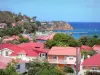 Les Saintes - Houses with red roofs of Terre-de-Haut overlooking the sea and the Tête Rouge battery