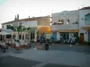 Les Saintes-Maries-de-la-Mer - Square with small houses lined with restaurant terraces