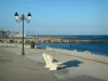 Les Saintes-Maries-de-la-Mer - Walk (path), with lampposts and bench, running alongside the sea and its rocks