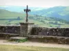 Salers - Parc Naturel Régional des Volcans d'Auvergne: view of the surrounding green landscape from the cross of the esplanade of Barrouze