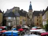 Sarlat-la-Canéda - Liberté square with a market, houses of the medieval old town and the bell tower of the Saint-Sacerdos cathedral, in Périgord