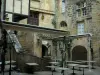 Sarlat-la-Canéda - Restaurant terrace and houses of the medieval old town, in Périgord