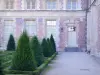 Sens - Flowerbeds of the Orangerie garden and facade of the Archiepiscopal Palace