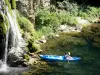 Tarn gorges - Canoe on River Tarn, near the Saint-Chély-du-Tarn waterfall; in the town of Sainte-Enimie, in the Cévennes National Park