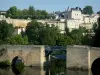 Thouars - Chouans bridge (medieval bridge) on River Thouet, trees along the water, and facades of the town