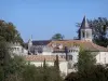 Torsac - Crenellations and machicolation of the castle, and octagonal bell tower of the Saint-Aignan church