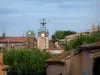 Tourtour - Trees, tower with a forged iron bell tower and houses of the village