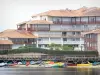 Vieux-Boucau Port d'Albret - Pier, colorful boats on the salt water lake and facades of the resort