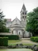 Vignory church - Apse and bell tower of the Saint-Étienne Romanesque church, and garden