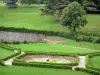 Virieu castle - View of the pond and the green squares of tje formal gardens