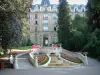 Vittel - Spa town: luxury hotel, trees, staircase and fountain with flowers
