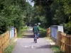Voie Verte (Green Lane) - Cyclists (cycling) on a cycle path of the Voie Verte (Green Lane,  former railroad), trees